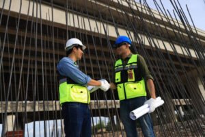 Two construction workers standing side by side at a job site in Sonoma, CA, representing Best Concrete Contracting.