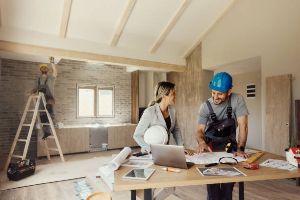 Workers are installing plasterboard (drywall) for gypsum walls in apartment is under construction, remodeling, renovation, extension, restoration and reconstruction