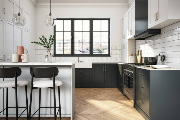 Elegant kitchen with white cabinets and granite countertops, highlighting a custom design for a contemporary home.