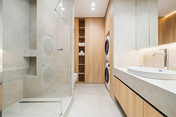 A modern bathroom featuring a spacious tub and a separate shower, showcasing a stylish remodeling design.
